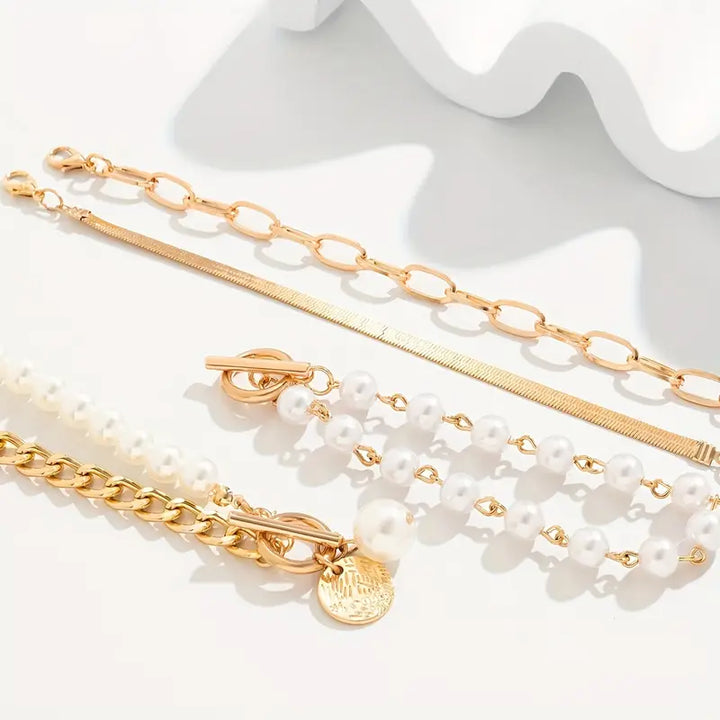 Elegant 4-Piece Gold Bracelet Set – Snake, Pearls and Links