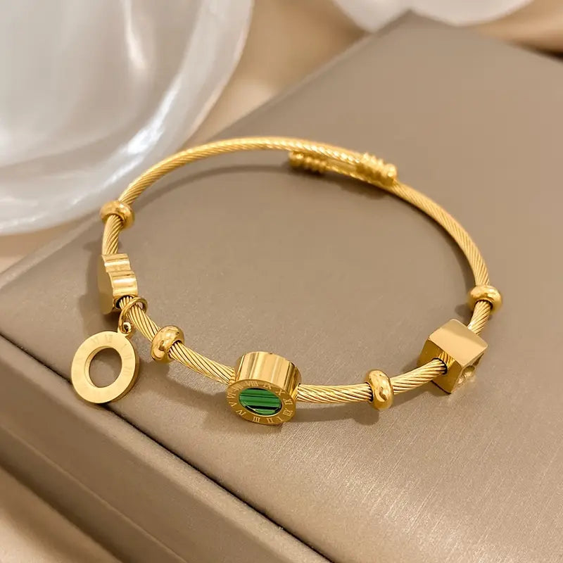 Golden Bracelet with a Green Gemstone