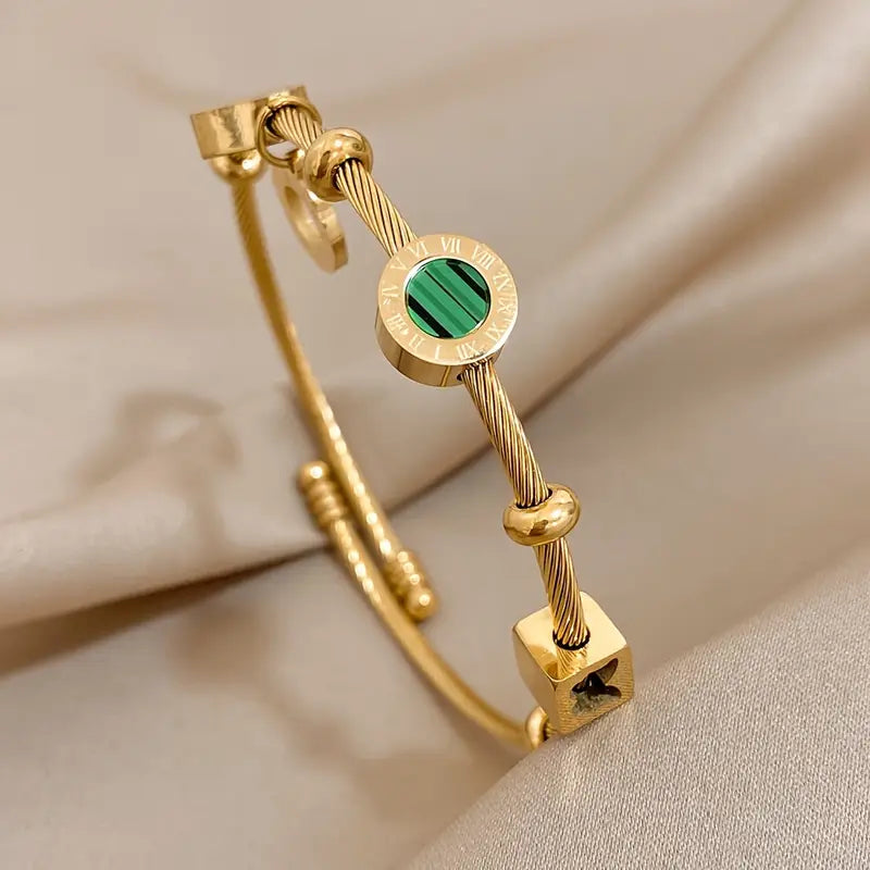 Golden Bracelet with a Green Gemstone