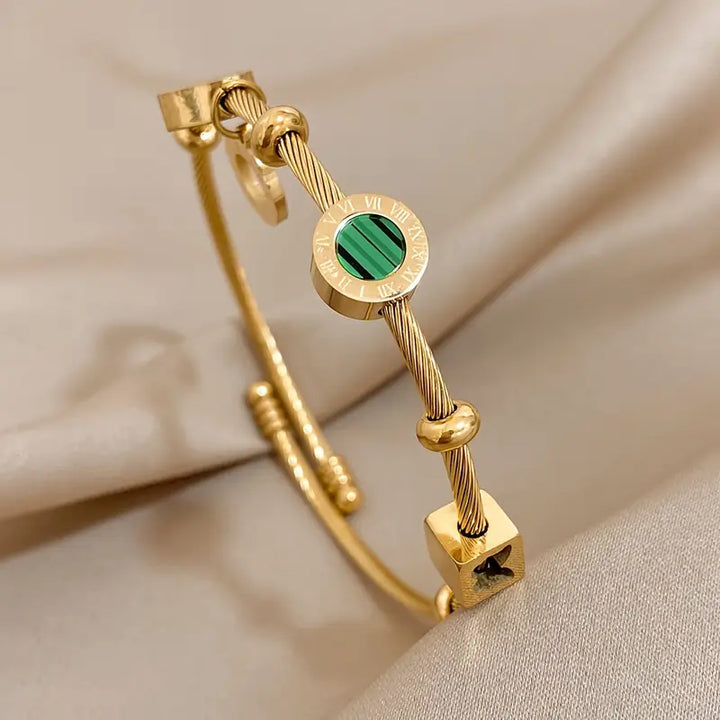 Golden Bracelet with a Green Gemstone